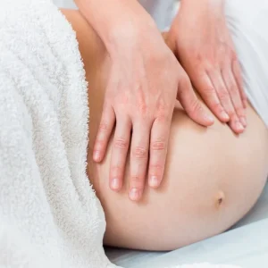 [fpdl.in]_close-female-hands-massage-therapist-makes-light-massage-belly-pregnant-girl-cosmetology-room_213607-551_large